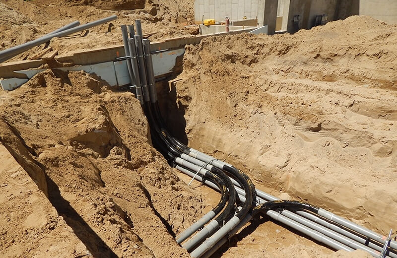 electrical conduit being buried underground