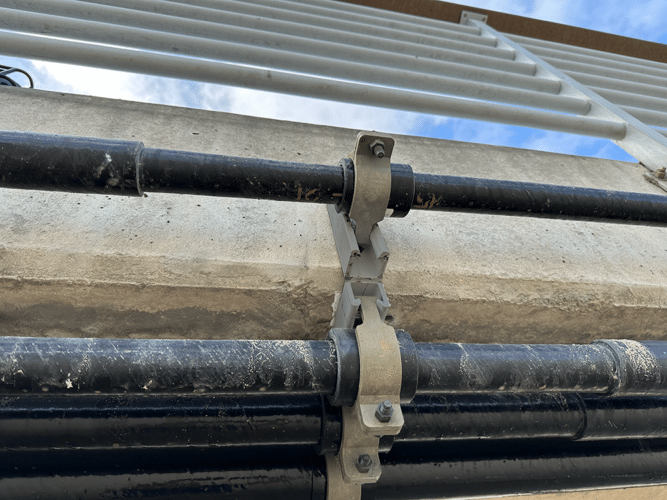 Champion Strut™ fiberglass strut support system supporting heavy conduit runs in an industrial facility